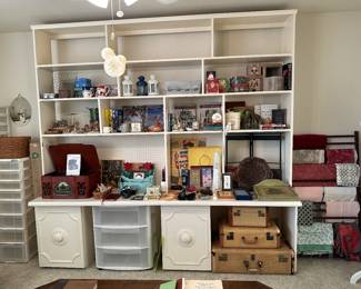 Entire wall unit includes shelves on top counter and two rollout cabinets underneath comes in parts to move bigger than it looks