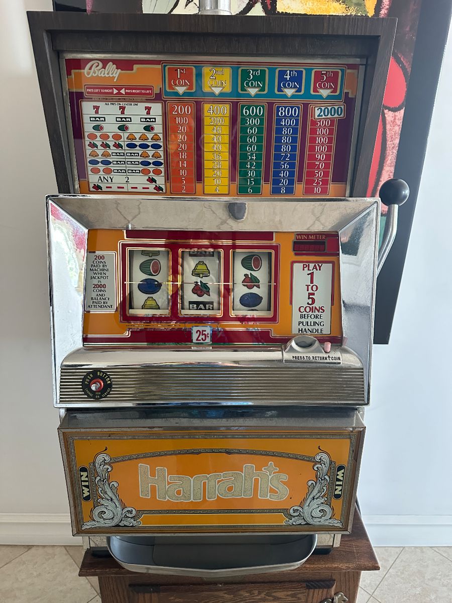 $400-vintage Bally slot machine, specifically a model associated with Harrah's Casino.