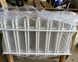 several boxes of garden fencing