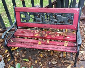 Child size park bench featuring African animals