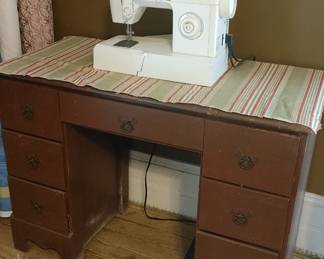 Sewing machine and desk