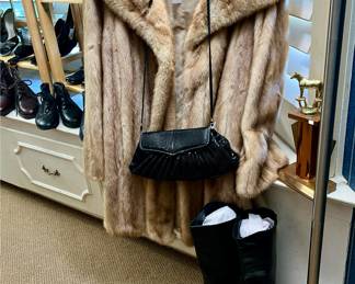 MINK FUR COAT AND RIDING BOOTS.