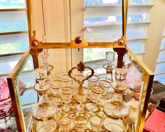 ANTIQUE TANTALUS LOCKED CASE BAR BELIEVED TO BE BACCARAT CRYSTAL.