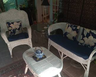 Wicker, rugs, glass tables, lamps