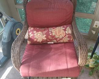 One of two matching wicker chairs