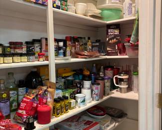 Panty full of foil, Cling Wrap, Tupperware, baking tools and accessories, spices, drink cups and pitchers with infusers.