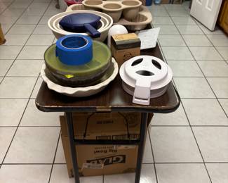 Lots of Pampered Chef items--various prices. Glad storage containers--brand new under the table.
