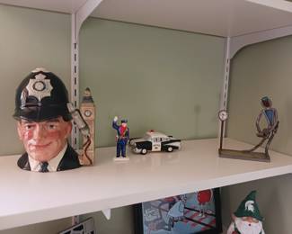 Several police officer related items including Royal Doulton Tobey mug