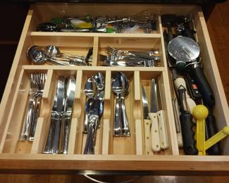Stainless steel flatware and a kitchen accessories