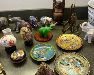 small cloisonné plates, eggs, and some lucky elephant figurines