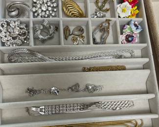 lots of costume jewelry, clip and pierced earrings, brooches, necklaces, bracelets, bangles, men's tie clips and cufflinks, etc.
