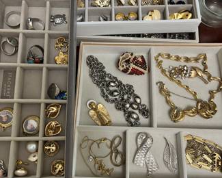 lots of costume jewelry, clip and pierced earrings, brooches, necklaces, bracelets, bangles, men's tie clips and cufflinks, etc.