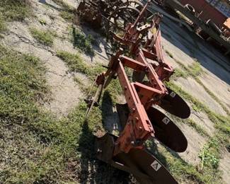 Allis Chalmers 3 bottom plow. Antique corn planter with steel wheels. Bid online at: https://modestlambestatesales.hibid.com/