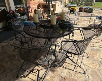 Wrought iron patio table and four chairs