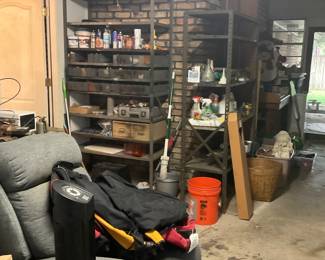 Various garage items, fans, recliner, hand tools, backpacks