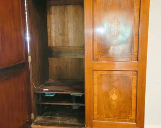Antique closet armoire with inlay design