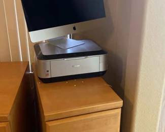 Wood File Cabinet Along With A Canon Printer And An Apple Monitor