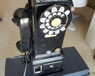 Original pay phone as installed in phone booth