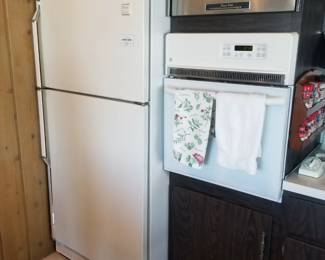 Refrigerator; GE wall oven; original and functional stainless steel "Power Vent"