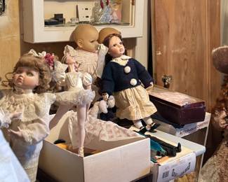 large selection of porcelain dolls, most with boxes, 
