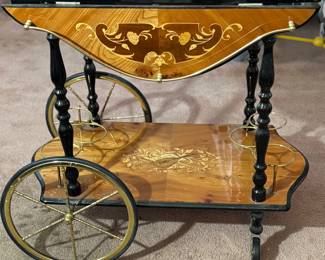 side view of ornate inlaid bar cart 