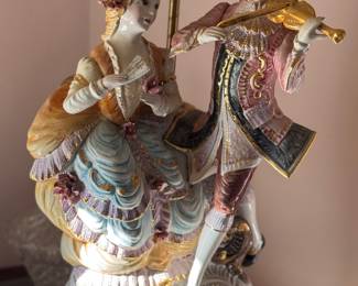 Large Capodimonte Figural lamp featuring a violinist and woman. 