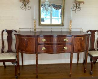 Henkel Harris Sideboard. Federal style with inlaid mahogany. Measures approximately 66” wide, 25” deep and 38” high.