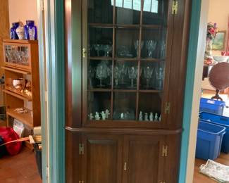 One of 2 Henkel Harris Fairfax 12 Pane lighted corner cabinet. Measures approximately 7 feet tall. 34” across the front. 30” deep.