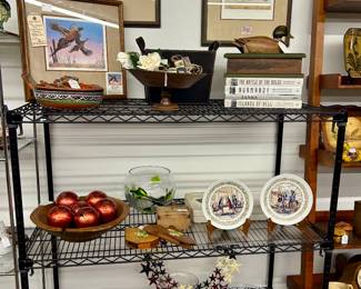 Duck prints, wooden duck box and coffee table books.