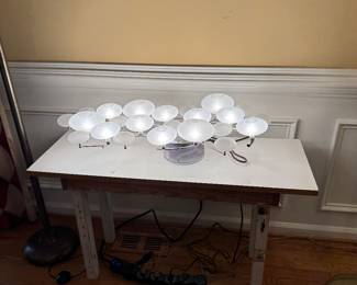 This is a hanging light fixture with long plug it also looks great as a lighted sculpture