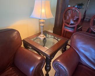 Oversized brown leather chair with rolled arms and nailhead trim. Very comfortable and supportive. Good overall condition with some natural leather patina.