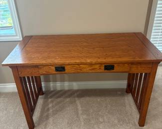 Mission-Style Oak Desk
Solid oak Mission-style desk with slatted sides and rich medium oak finish. Features a pull-out keyboard shelf and two front drawers with recessed pulls. Perfect size for a home office, student desk, or writing table.