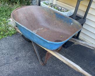 Single-wheel, metal tub with wood handles