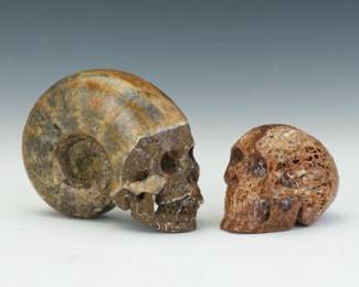 Two Carved Stone Skulls, Including Fossil Ammonite Skull