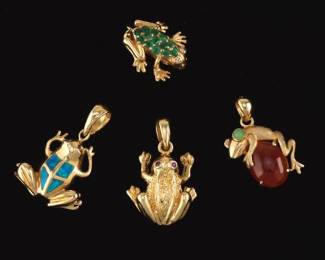A Collection of Four Frog Pendants and Brooch