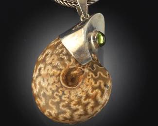Ammonite Fossil Pendant Necklace on a Silver Chain with Green GemStone