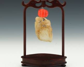 Carved Jade Ornament with Coral Surmount on a Stand