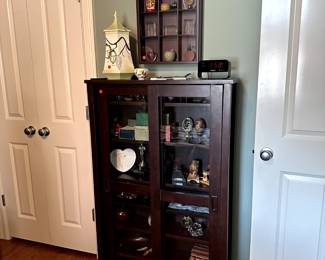Curio cabinet and shadow box.