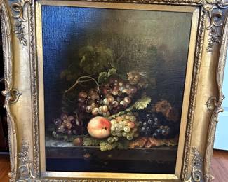 Traditional still life of fruits in heavy gilt frame.