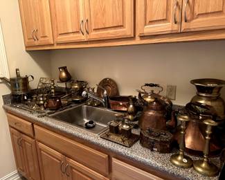 A few of the many copper and brass antique decorations.