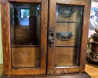 Oak and beveled glass jewelry chest.