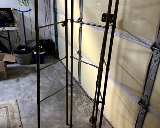 Brass, wall mounted & articulating wardrobe organizer, custom made by The Carlin Shop for designer Charles Faudree.