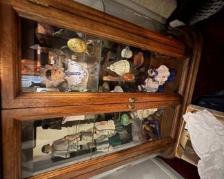 . . . . . . the bottom of the curio featuring Asian-themed figures