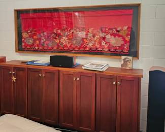 Large Mahogany Cabinet, above that an Antique Tapestry from Crete, hand woven.
Cabinet is 97 x 40 inches, the framed tapestry is 93 x 44 inches