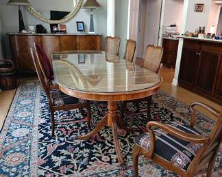 Antique Yew Wood Dining Table with Cane back Dining Chairs.