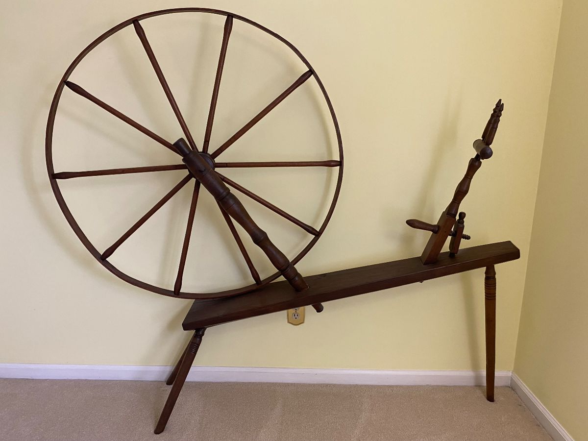 Antique spinning wheel.
