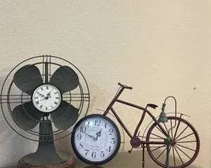 Clock Display with Bicycle, Fan, and Lantern Design