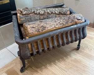 Vintage Cast Iron Wood Holder with Rolling Wheels