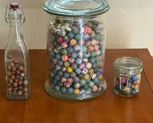 Colorful Collection of Clay-Like Marbles in Vintage Glass Jars