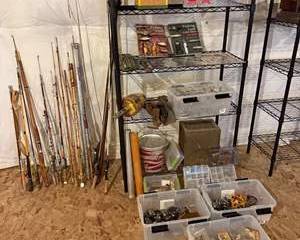 Fly Fishing Gear Collection with Rods, Reels, Lures, and Tackle Boxes